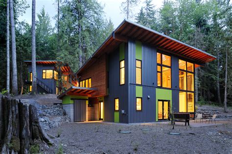 houses with single slope roofs and metal siding|modern house with slanted roof.